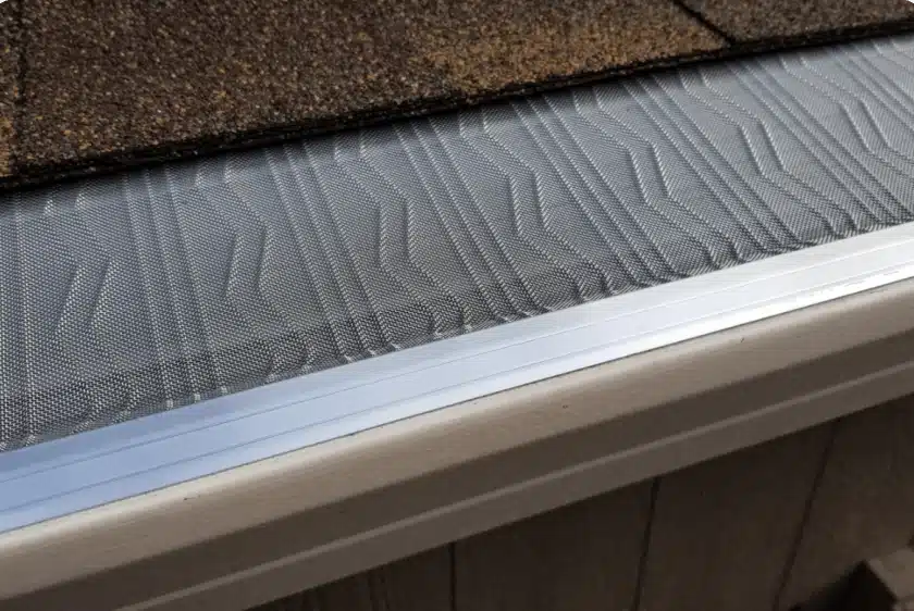 SmartStyle professional gutter guard installation showing micro-mesh technology