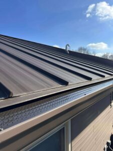 new gutter guard mesh in a metal roofing