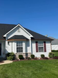 white house with new gutter repaired