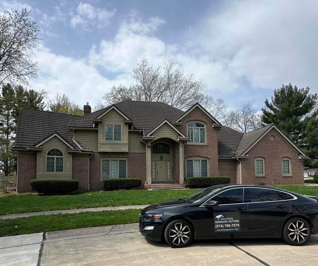 brick home with new gutters from smartstyle seamless gutters